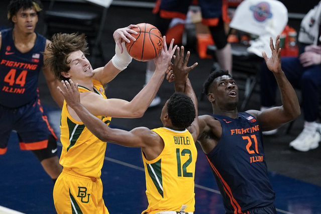 Baylor's Matthew Mayer (24) takes the rebound away from Illinois' Kofi Cockburn (21) as Butler's Jared Butler (12) watches during the second half of an NCAA college basketball game Wednesday, December 2, 2020, in Indianapolis. (Photo by Darron Cummings/AP Photo)