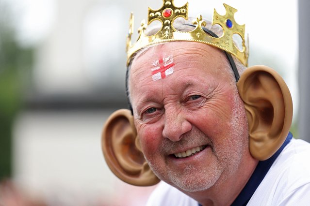 An England fan wearing giant ears poses prior to the UEFA Euro 2024 Group C football match between Denmark and England at the Frankfurt Arena in Frankfurt am Main on June 20, 2024. (Photo by Adrian Dennis/AFP Photo)