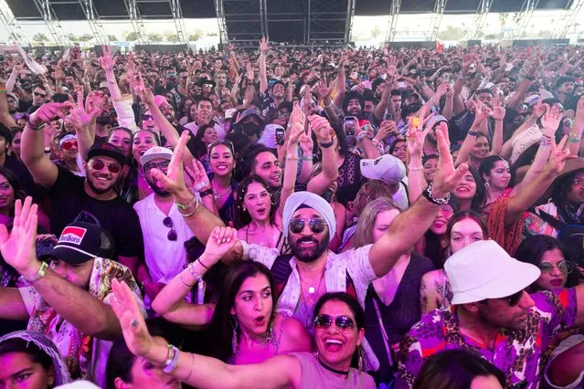 Spectators watch Diljit Dosanjh, an Indian singer perform onstage at the Coachella Valley Music & Arts Festival in Indio, California, U.S., April 22, 2023. (Photo by Aude Guerrucci/Reuters)