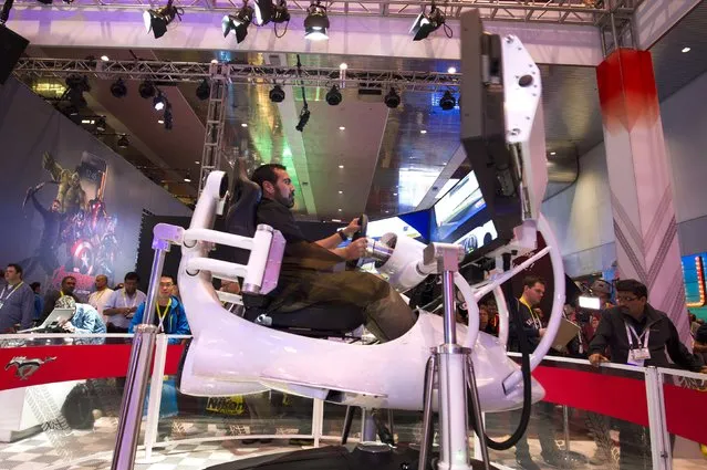 Thomas Bustos, a technology manager at the University of California, Merced, tries out a driving simulator in a Ford booth during the 2015 International Consumer Electronics Show (CES) in Las Vegas, Nevada January 6, 2015. (Photo by Steve Marcus/Reuters)