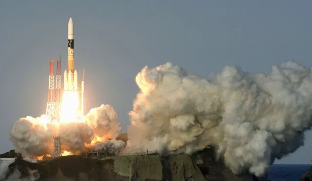 A H-IIA rocket, Telesat's broadcast and telecommunication satellite, lifts off from the launching pad at Tanegashima Space Center on the Japanese southwestern island of Tanegashima, in this photo taken by Kyodo November 24, 2015. (Photo by Reuters/Kyodo News)