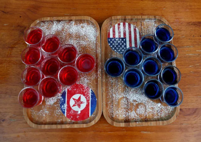 Special red and blue shots offered at Escobar bar to mark the summit meeting between U.S. President Donald Trump and North Korean leader Kim Jong Un, are displayed on a table in Singapore June 4, 2018. (Photo by Edgar Su/Reuters)
