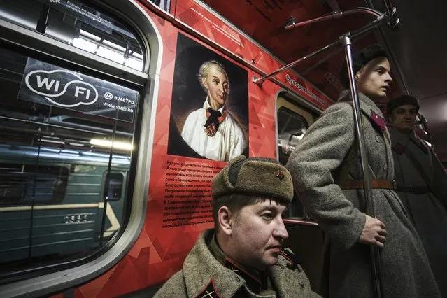 Participants wearing military uniform of the Great Patriotic War during the launch of the Great Military Leaders themed train of the Moscow Metro at the Cherkizovo depot on November 7, 2016. (Photo by Ramil Sitdikov/Sputnik)