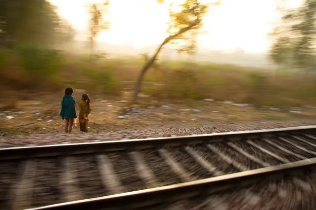 “Trackside Sisters”. Two young girls next to the railway tracks in Tamil Nadu, India. India's arterial-like network of tracks attracts trackside-dwellers across the entire subcontinent. (Photo and caption by Danny Pemberton/National Geographic Traveler Photo Contest)