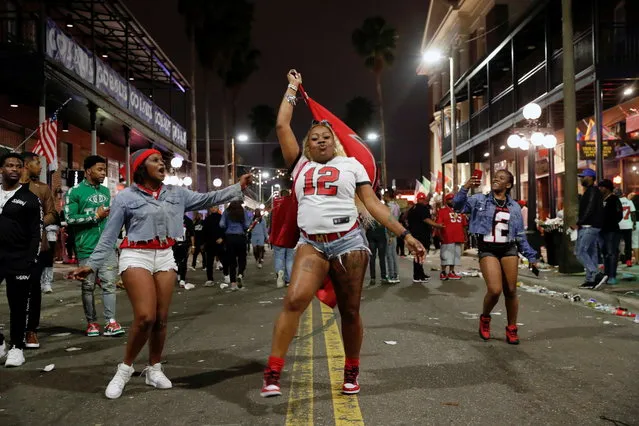 People gather in Ybor city after the Tampa Bay Buccaneers Super Bowl LV win over the Kansas City Chiefs, in Tampa, Florida, U.S., February 8, 2021. (Photo by Shannon Stapleton/Reuters)