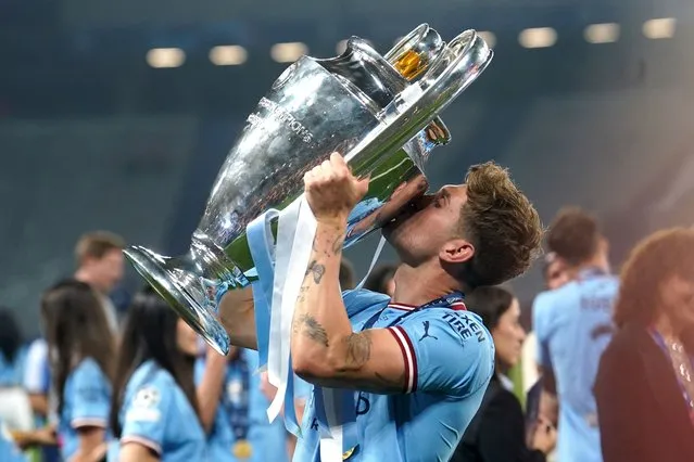 Manchester City's John Stones with the UEFA Champions League Trophy following victory over Inter Milan in the UEFA Champions League Final at the Ataturk Olympic Stadium, Istanbul on Saturday, June 10, 2023. (Photo by Martin Rickett/PA Images via Getty Images)