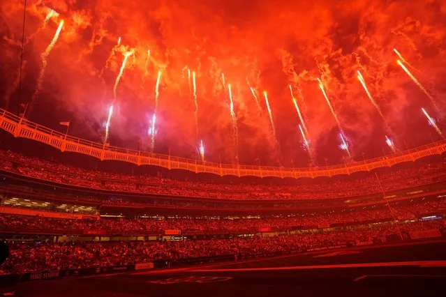 New York Yankees fans enjoy a pyrotechnics display after a baseball game against the Baltimore Orioles, Monday, July 3, 2023, in New York. (Photo by Frank Franklin II/AP Photo)