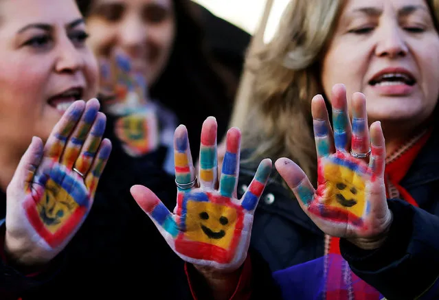 Protesters show their painted hands during a protest against a proposal that would have allowed sentencing in cases of sexual abuse committed “without force, threat or trick” before Nov. 16, 2016 to be indefinitely postponed if the perpetrator marries the victim, in front of the Turkish Parlaiment in Ankara, Turkey, November 22, 2016. (Photo by Umit Bektas/Reuters)