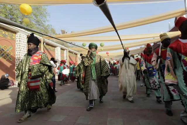 Pipers blow their instruments during a procession with new Emir of Kano Muhamadu Sanusi II (not pictured) at his coronation in Kano, Kano State, February 7, 2015. (Photo by Afolabi Sotunde/Reuters)