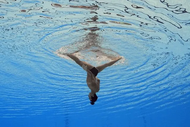 Eduard Kim, of Kazakhstan, competes in the men's solo free of artistic swimming at the World Swimming Championships in Fukuoka, Japan, Tuesday, July 18, 2023. (Photo by David J. Phillip/AP Photo)