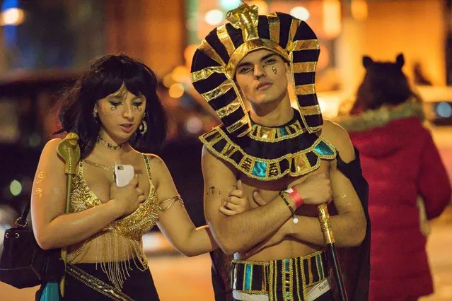 The cold temperatures didn't seem to bother King Tut and Cleopatra durind Halloween night in Manchester, England on Saturday, October 27, 2018. Many were seen making the most of the night in their impressive outfits as they partied in bars, clubs and pubs across the country. (Photo by Mercury Press)