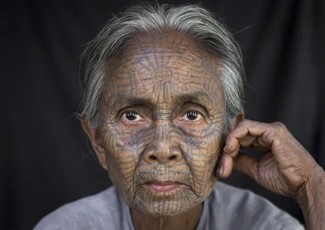 A woman from the Chinn tribe who inhabit the Mrauk U region. The design is famous for looking like a spiders web, in February, 2015, in Myanmar, Burma. (Photo by Eric Lafforgue/Barcroft Media)