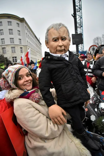 A demonstrator holds a figurine of Jaroslaw Kaczynski during the third day of a protest outside the Parliament building in Warsaw, Poland December  December 18, 2016. (Photo by Franciszek Mazur/Reuters/Agencja Gazeta)