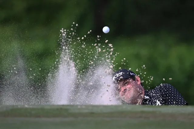 Patrick Reed of the US hits a shot out of the bunker on day two of the Hong Kong Open at Fanling golf club in Hong Kong on November 10, 2023. (Photo by Peter Parks/AFP Photo)