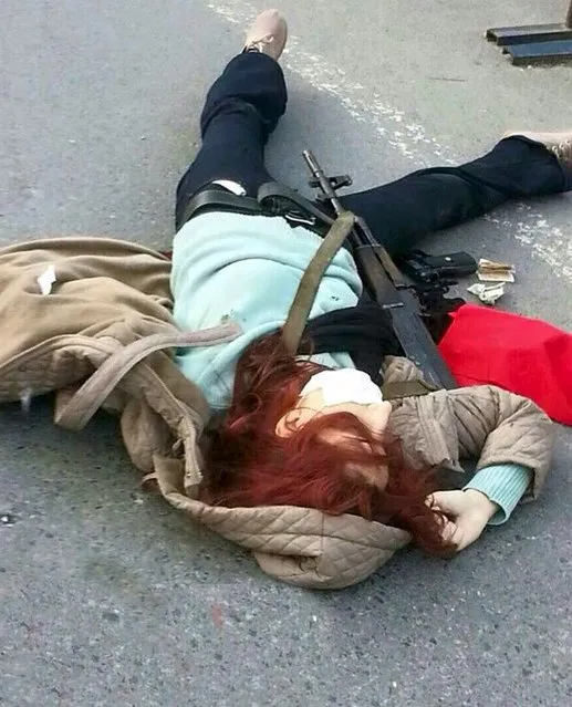 The body of an unidentified armed woman lies on the ground near Istanbul's police headquarters April 1, 2015. Turkish police shot dead the woman carrying guns and hand grenades and detained a man as they tried to attack Istanbul's police headquarters on Wednesday, officials and media said, the third attack on an official building in the past two days. (Photo by Reuters/Ihlas News Agency)