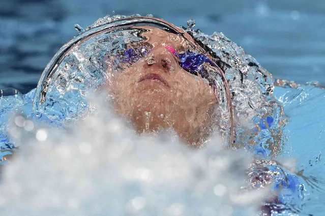 Regan Smith of the United States swims in the final of the women's 100-meter backstroke at the 2020 Summer Olympics, Tuesday, July 27, 2021, in Tokyo, Japan. (Photo by Matthias Schrader/AP Photo)