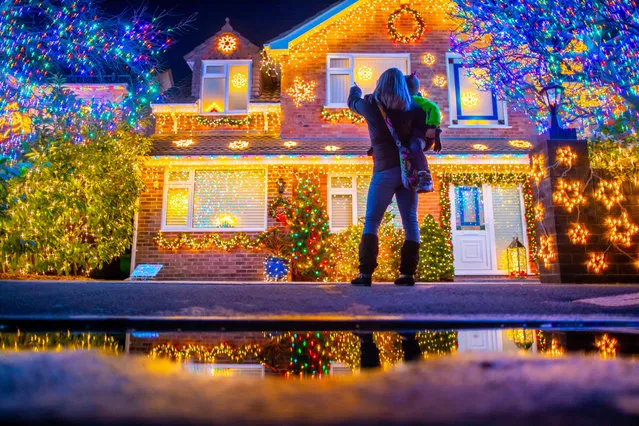 Christmas lights are displayed on houses in Trinity Close in Burnham-on-Sea, Somerset, UK on December 3, 2018. For over 10 years the residents of Trinity Close have decorated their homes and gardens with more than a 100,000 colourful Christmas lights. The residents display aims to raise money for local charities and will run until early January. (Photo by Brad Wakefield/Rex Features/Shutterstock)