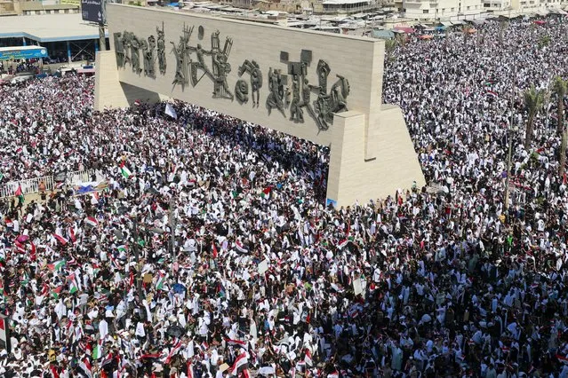 Protesters gather at Tahrir Square during an anti-Israel demonstration in Baghdad on October 13, 2023, amid the ongoing battles between Israel and the Palestinian Islamist group Hamas. (Photo by Ahmad Al-Rubaye/AFP Photo)