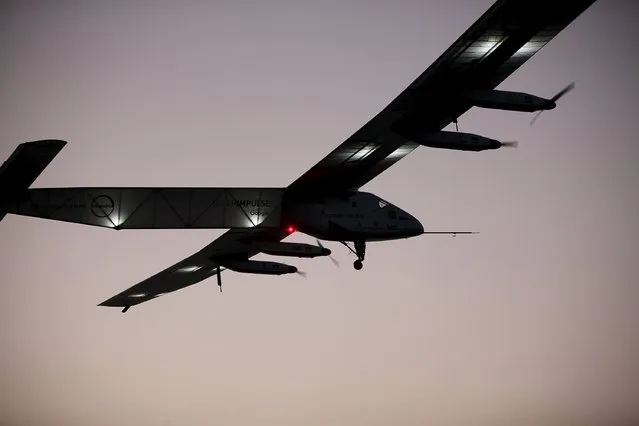 The Solar Impulse 2 airplane, flown by test pilot Markus Scherdel, flies off the coast of Oahu during a test flight from Kalaealoa Airfield in Kapolei, Hawaii, March 3, 2016. (Photo by Hugh Gentry/Reuters)