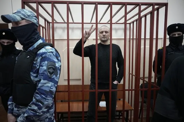 Sergei Udaltsov, Russian left-wing political activist stands in a cage in a courtroom in Moscow, Russia, Friday, January 12, 2024. Sergei Udaltsov, a Russian pro-war activist and critic of President Vladimir Putin, was remanded into custody Thursday over alleged terrorism offenses, his lawyer told the Russian state news agency Tass. (Photo by Alexander Zemlianichenko/AP Photo)