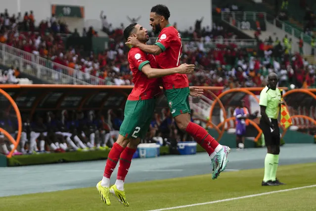 Morocco's Achraf Hakimi, left, celebrates after he scored the opening goal during the African Cup of Nations Group F soccer match between Morocco and DR Congo, at the Laurent Pokou stadium in San Pedro, Ivory Coast, Sunday, January 21, 2024. (Photo by Themba Hadebe/AP Photo)