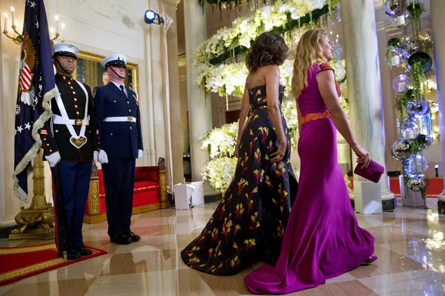 First lady Michelle Obama and Sophie Grégoire Trudeau walk through the White House as they follow their husbands President Barack Obama and Canadian Prime Minister Justin Trudeau to the State Dinner in Washington, Thursday, March 10, 2016. (Photo by Jacquelyn Martin/AP Photo)