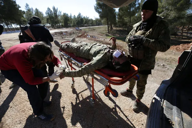 Medics tend to the wounds of a rebel fighter that got injured while rebels advance towards the northern Syrian town of al-Bab, on the outskirts of the town, Syria January 29, 2017. (Photo by Khalil Ashawi/Reuters)