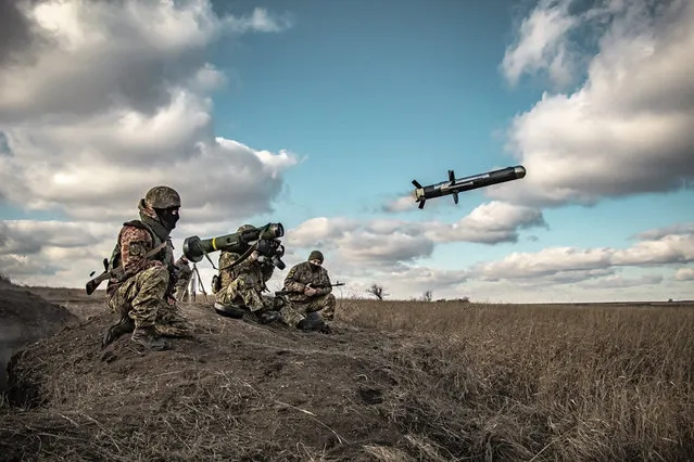 In this image released by Ukrainian Defense Ministry Press Service, Ukrainian soldiers use a launcher with US Javelin missiles during military exercises in Donetsk region, Ukraine, Thursday, December 23, 2021. (Photo by Ukrainian Defense Ministry Press Service via AP Photo)