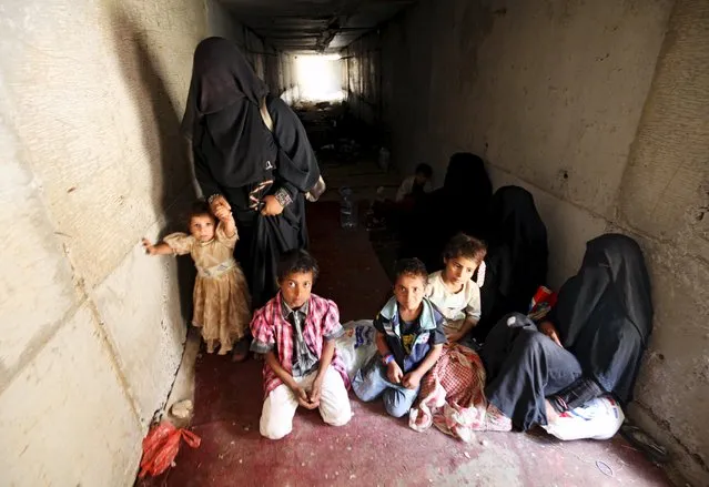 Displaced people rest in an underground water tunnel after they were forced to flee their homes due to ongoing air-strikes carried out by the Saudi-led coalition in Sanaa May 2, 2015. (Photo by Mohamed al-Sayaghi/Reuters)
