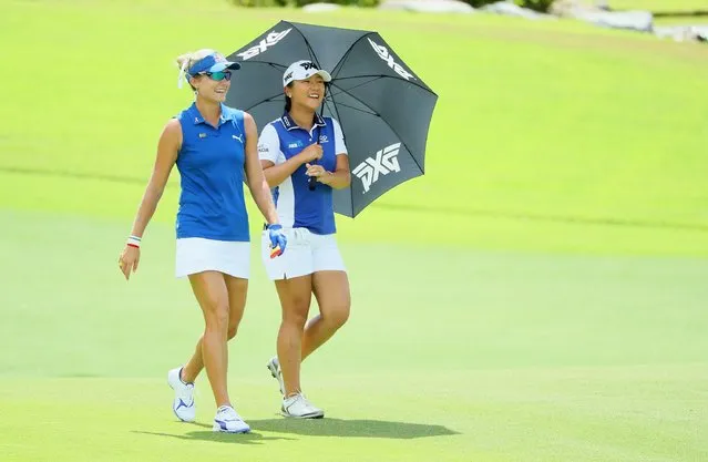 Lexi Thompson of the USA (left) and Lydia Ko of New Zealand share a joke on the fifth hole during the first round of  the HSBC Women's Champions on the Tanjong Course at Sentosa Golf Club on March 2, 2017 in Singapore. (Photo by Andrew Redington/Getty Images)