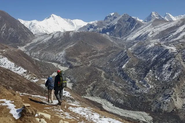 People trek in the Khumbu Valley in the Everest region of Nepal in this picture taken April 15, 2016. REUTERS/Antoni Slodkowski