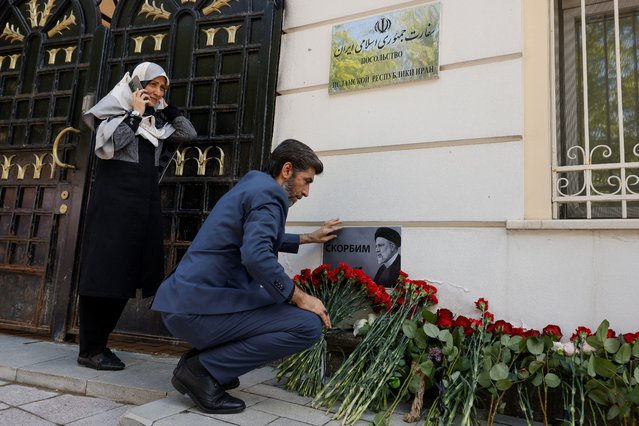 People come to the Iranian embassy to pay tribute to Iran's President Ebrahim Raisi, Foreign Minister Hossein Amirabdollahian and other victims of a recent helicopter crash in mountainous terrain near Iran's border with Azerbaijan, in Moscow, Russia, on May 20, 2024. (Photo by Maxim Shemetov/Reuters)
