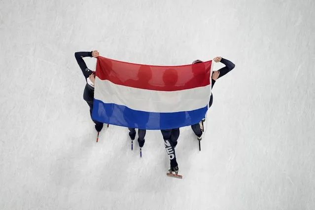 Team Netherlands celebrate after winning the women's 3000-meter relay final during the short track speedskating competition at the 2022 Winter Olympics, Sunday, February 13, 2022, in Beijing. (Photo by Jeff Roberson/AP Photo)