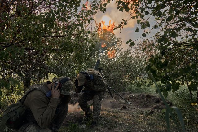 Soldiers of the assault brigade defend the frontline, which passes through the Ukrainian boarder city of Vovchansk, in Chuhuiv Raion, Kharkiv Oblast, which is bombarded daily by heavy artillery on May 20, 2024 in Vovchansk, Ukraine. In recent days, Russian forces have gained ground in the Kharkiv region, an area that Ukraine had largely reclaimed in the months following Russia's initial large-scale invasion in February 2022. (Photo by Kostiantyn Liberov/Libkos/Getty Images)
