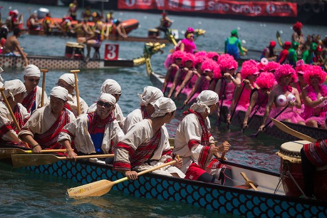 Dragon boat racers prepare for the fancy dress race on July 5, 2015 in Hong Kong, Hong Kong. (Photo by Taylor Weidman/Getty Images for Hong Kong Images)