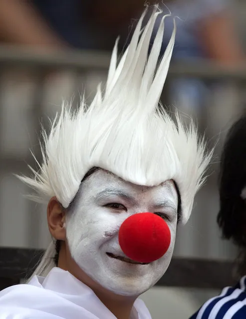 A Japan fan waits for the United States and Japan to play in the FIFA Women's World Cup soccer championship in Vancouver, British Columbia, Canada, Sunday, July 5, 2015. (Photo by Darryl Dyck/The Canadian Press via AP Photo)