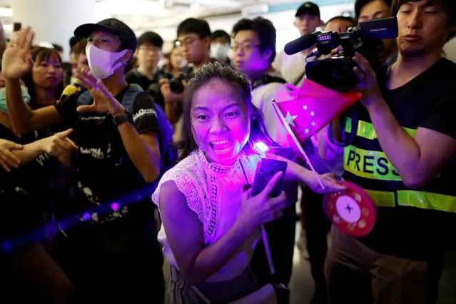 A pro-China demonstrator shouts during skirmishes with an anti-government group at Yuen Long station in Hong Kong, China on September 12, 2019. (Photo by Jorge Silva/Reuters)