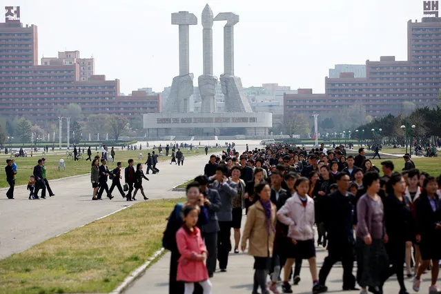 People walk in front of the Monument to the Foundation of the Workers' Party in Pyongyang, North Korea April 16, 2017. (Photo by Damir Sagolj/Reuters)