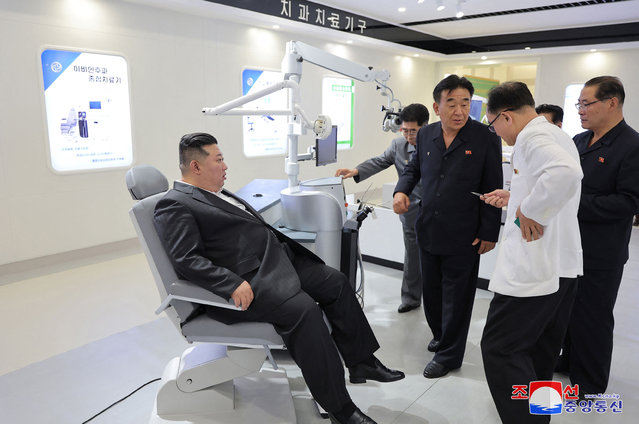 This picture taken on July 2, 2024 and released from North Korea's official Korean Central News Agency (KCNA) via KNS on July 3, 2024 shows North Korea's leader Kim Jong Un (L) inspecting a medical equipment production plant with members of the Party's central leadership organisation at an undisclosed location in North Korea. (Photo by KCNA via KNS/AFP Photo)