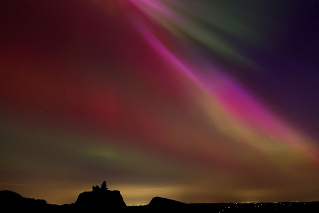 The aurora borealis, also known as the 'northern lights’, are seen over The Roaches near Leek, Staffordshire, Britain, on May 10, 2024. (Photo by Carl Recine/Reuters)