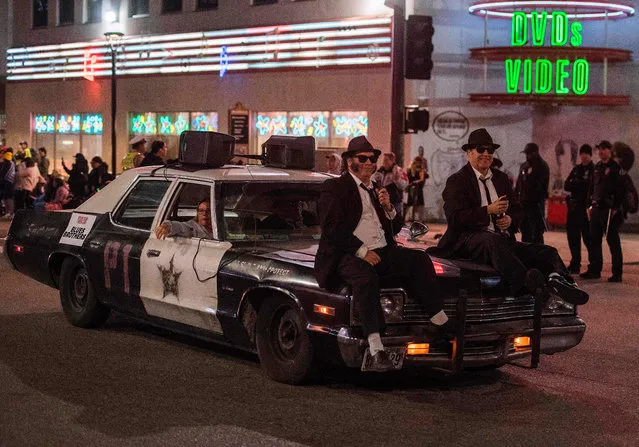 A car from the “Blues Brothers” movie is driven down Sunset Blvd during the 88th annual Hollywood Christmas Parade in Hollywood, California on December 1, 2019. (Photo by Mark Ralston/AFP Photo)