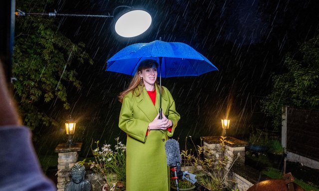 Deputy leader of the Labour Party Angela Rayner being interviewed by the BBC in the rain about the exit polls from her garden in Ashton-under-Lyne on July 5, 2024. (Photo by Jill Mead/The Guardian)