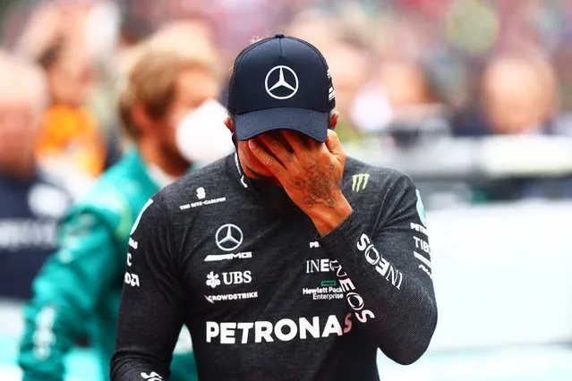 Lewis Hamilton of Great Britain and Mercedes wipes his face on the grid during the F1 Grand Prix of Emilia Romagna at Autodromo Enzo e Dino Ferrari on April 24, 2022 in Imola, Italy. (Photo by Dan Istitene – Formula 1/Formula 1 via Getty Images)