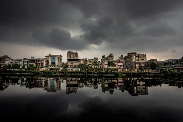 Rain clouds hover in the sky in Gauhati, India, Wednesday, May 25, 2022. (Photo by Anupam Nath/AP Photo)