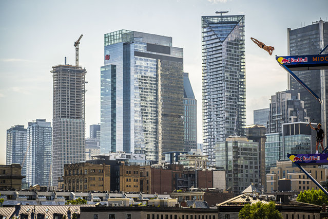 In this handout photo provided by Red Bull, David Colturi of the USA dives from the 27 metre platform during the second competition day of the sixth stop of the Red Bull Cliff Diving World Series on August 24, 2024 at Montreal, Canada. (Photo by Romina Amato/Red Bull via Getty Images)