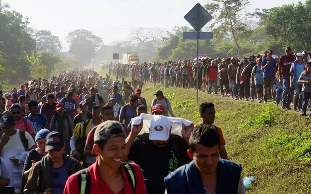 Hundreds of Central American people, belonging to the so-called migrant caravan, walk through the town of Frontera Hidalgo, in the state of Chiapas, Mexico, 23 January 2020. In mid-January, thousands of Central American migrants, mostly from Honduras, began a new caravan exodus in order to reach the United States. (Photo by Juan Manuel Blanco/EPA/EFE/Rex Features/Shutterstock)