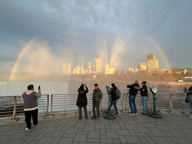 People at Niagara Falls State Park watch Niagara Falls and the rainbow ahead of a solar eclipse to take place later in the day, in New York, U.S., April 8, 2024. (Photo by Soren Larson/Reuters)