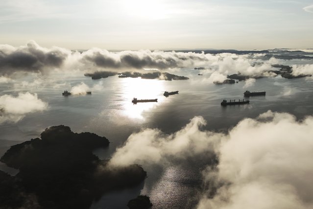 Cargo ships wait to transit the Panama Canal in Gatun Lake in Colon, Panama, September 2, 2024. (Photo by Matias Delacroix/AP Photo)