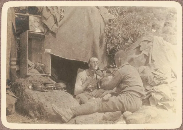 Q.M. Maloney shaving, (as another soldier holds up a mirror for him, June? 1915)