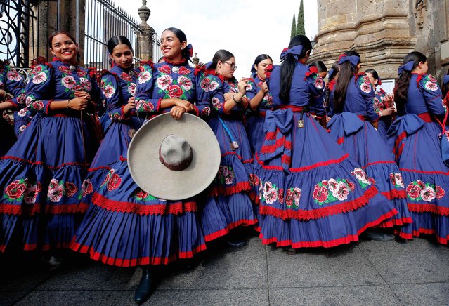 A group of “Escaramuzas” (women dressed in traditional costume) wait in the streets of Guadalajara, Jalisco state, Mexico, on September 14, 2023, during celebrations for the “International Charro and Charreria Day”. Mexican charrerÌa was declared Intangible Cultural Heritage of Humanity by Unesco in 2016. (Photo by Ulises Ruiz/AFP Photo)